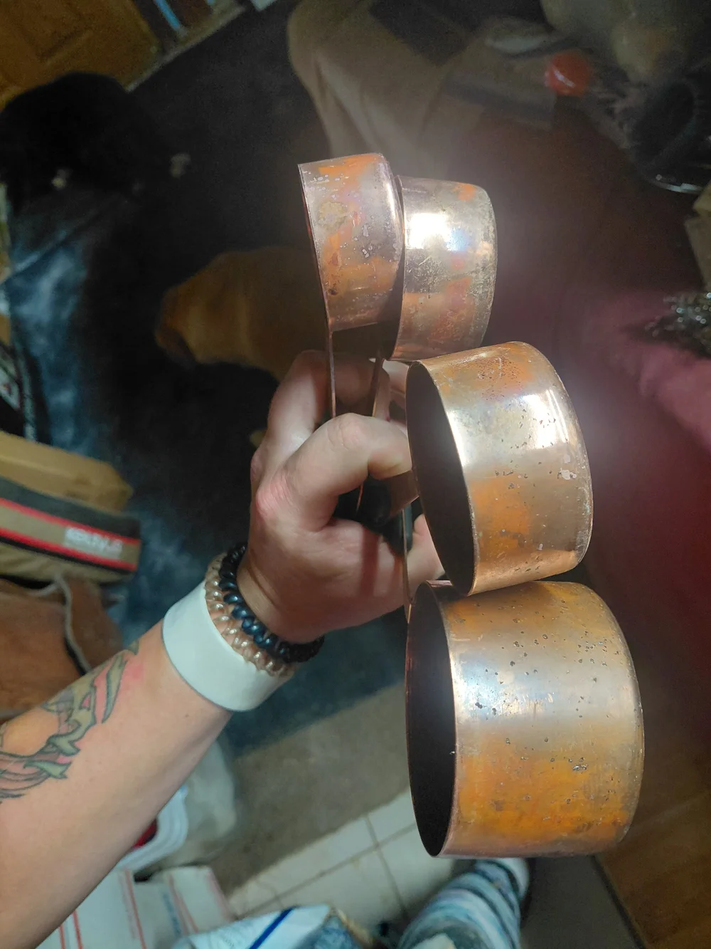 set of copper-plated stainless steel measuring cups